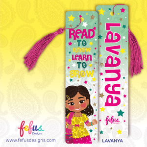 Personalised Desi girl metal bookmark by Fefus Designs featuring hand-drawn South Asian girl 'Lavanya'. The high-gloss aluminium bookmark showcases vibrant cultural fashion and includes a matching tassel. Ideal gift for South Asian girls – perfect for birthdays, back-to-school, or party favours.