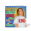 Teen boys Birthday card with a mixed race boy wearing a 'King' shirt and celebratory colourful text 'Happy Birthday King' on a blue background by Fefus Designs