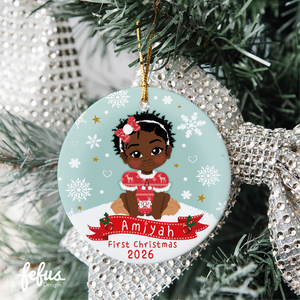 Personalised Black baby girl Christmas bauble by Fefus Designs, designed as a keepsake for the Christmas tree.