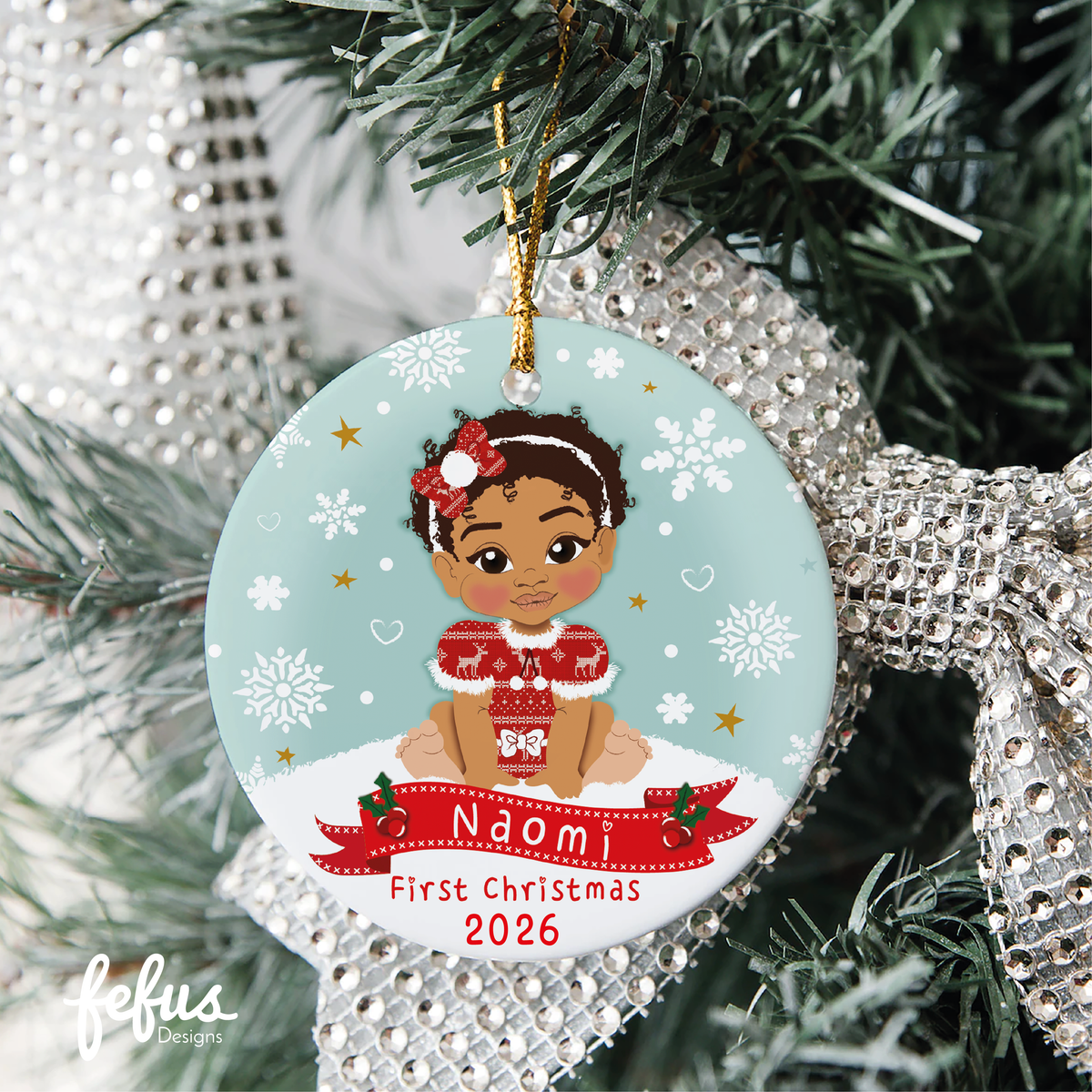 Personalised brown baby girl Christmas bauble by Fefus Designs, designed as a keepsake for the Christmas tree.