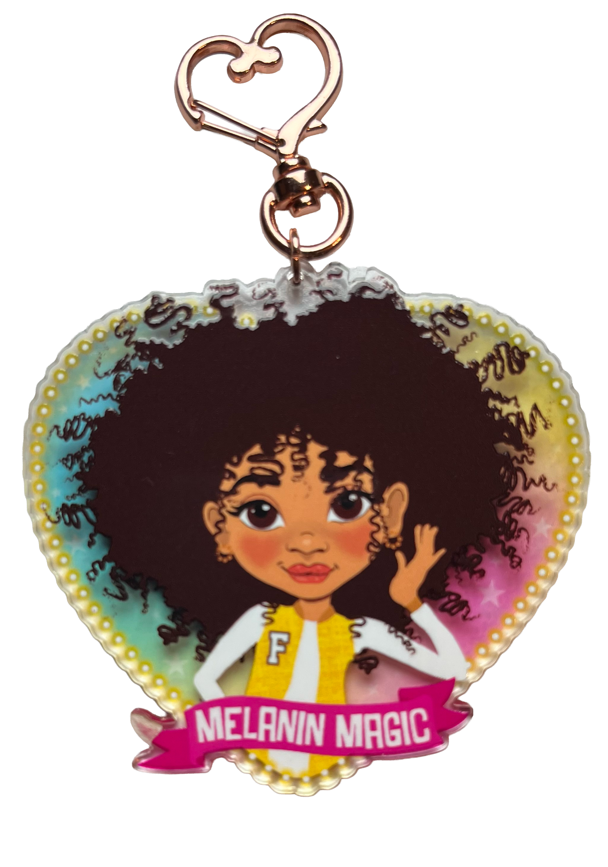 Heart-shaped keychain with a cartoon character and 'Melanin Magic' text on a white background