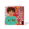 Greeting card with illustration of a young person and motivational text on a red background. Mixed race boy with big curly hair wearing KING baseball shirt – True King affirmation birthday card by Fefus Designs